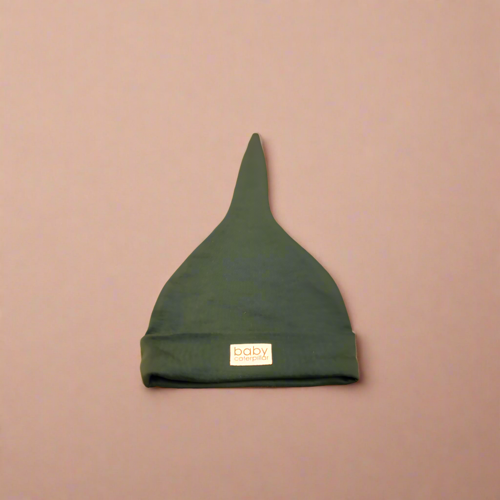 Forest green merino wool baby beanie, soft and breathable, made in New Zealand