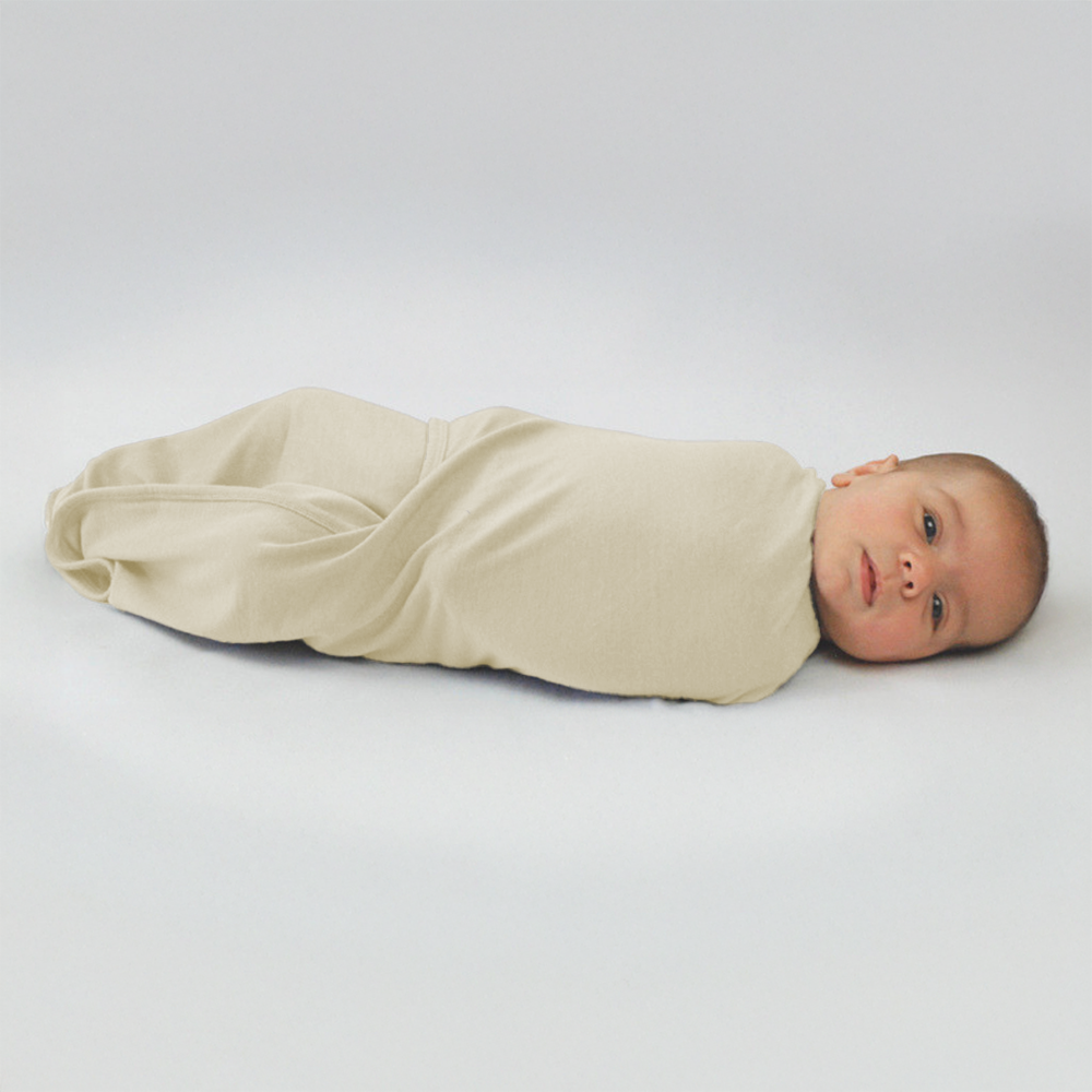 Cream merino wool fitted baby swaddle wrap made in New Zealand by Baby Caterpillar