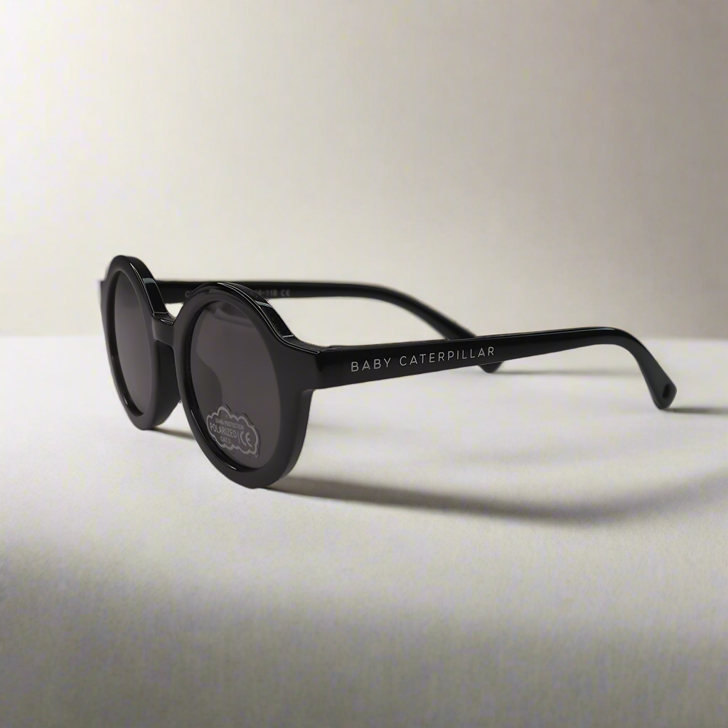 Baby Caterpillar Sunglasses in Buttercup Black with flexible frame and UV-protective lenses, designed for ages 0–2 years