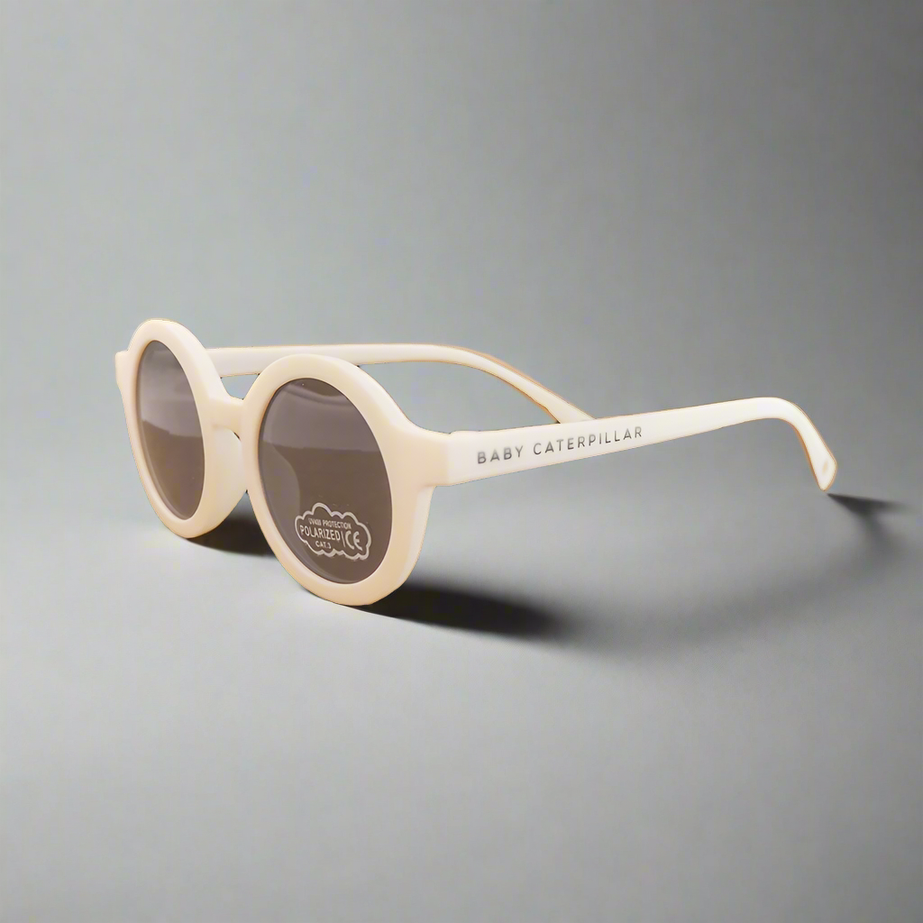 Baby Caterpillar Sunglasses in Buttercup White with flexible frame and UV-protective lenses, designed for ages 0–2 years