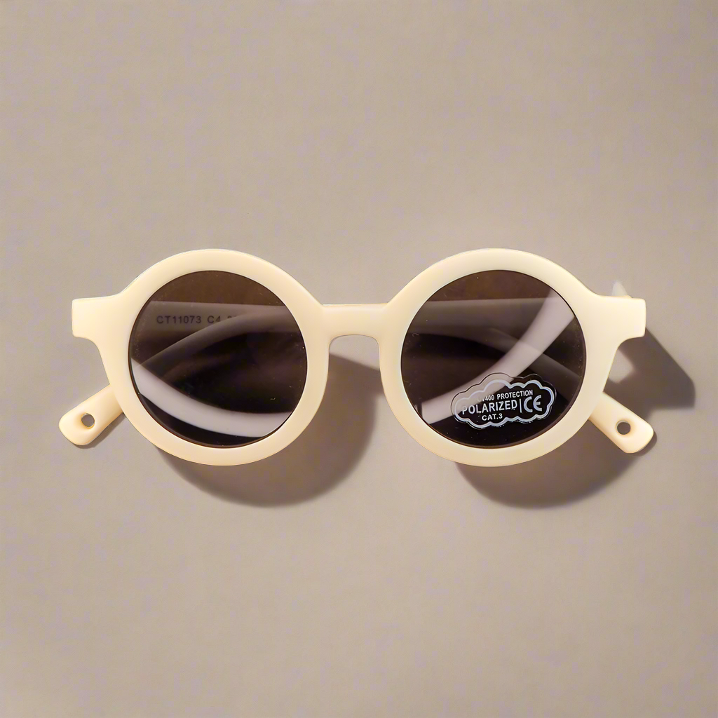 Baby Caterpillar Sunglasses in Buttercup White with flexible frame and UV-protective lenses, designed for ages 0–2 years