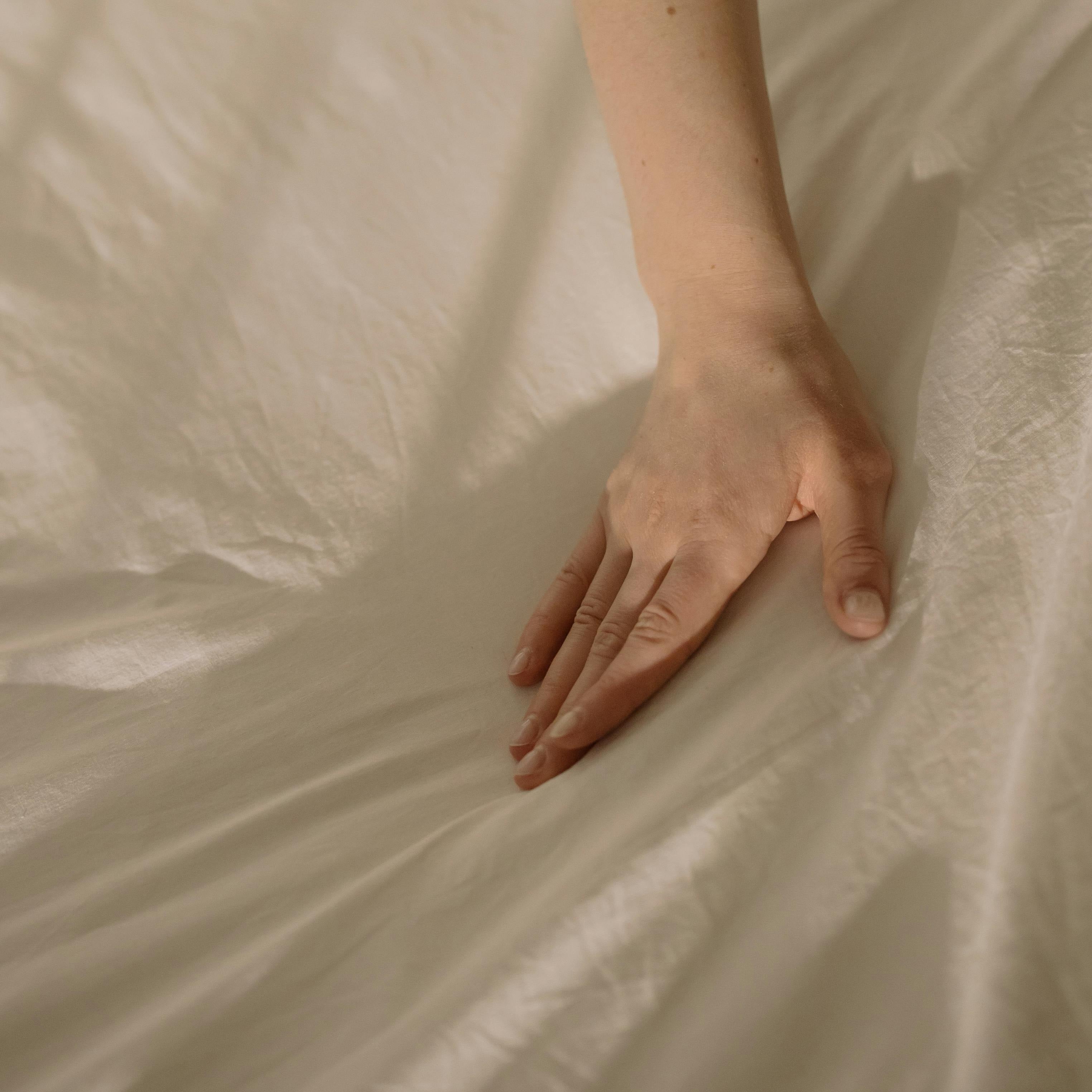 hand touching fabric