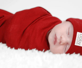 Merino Ruby red fitted swaddle wrap by Baby Caterpillar