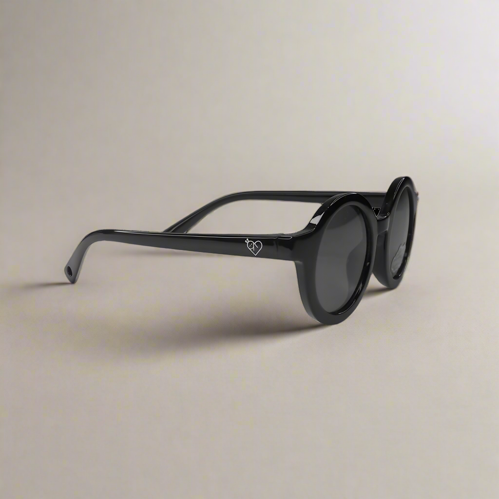Baby Caterpillar Sunglasses in Buttercup Black with flexible frame and UV-protective lenses, designed for ages 0–2 years