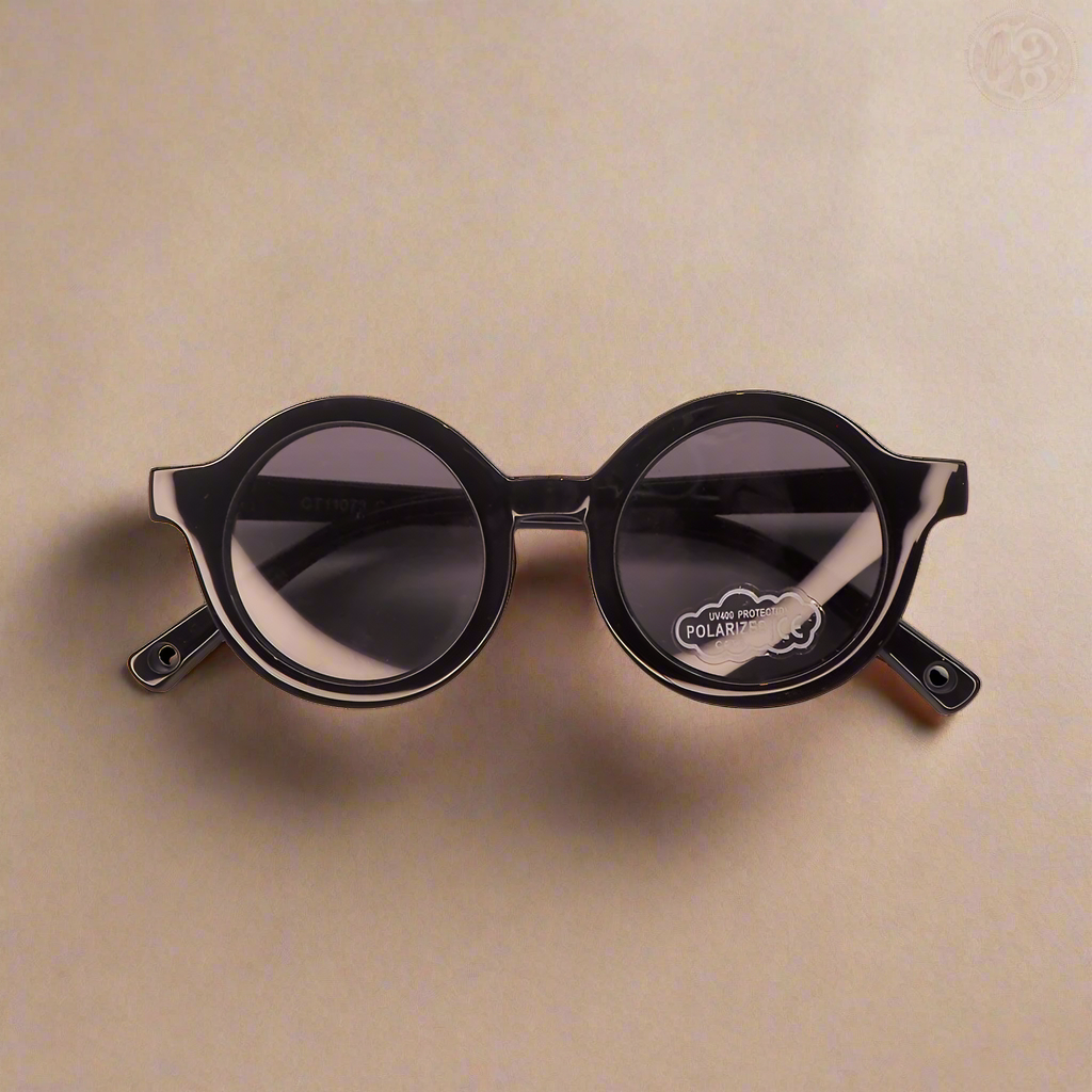 Baby Caterpillar Sunglasses in Buttercup Black with flexible frame and UV-protective lenses, designed for ages 0–2 years