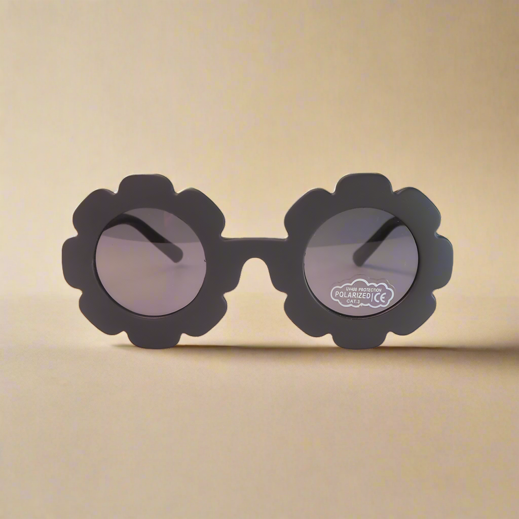 Black sunglasses with flower-shaped frames on a white background